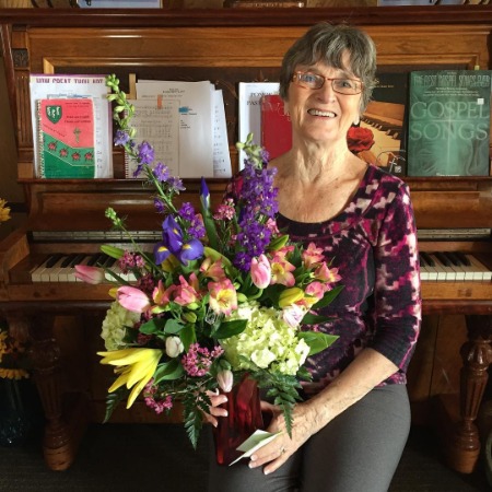 Shaun Johnston's mother holding a beautiful bunch of flowers.